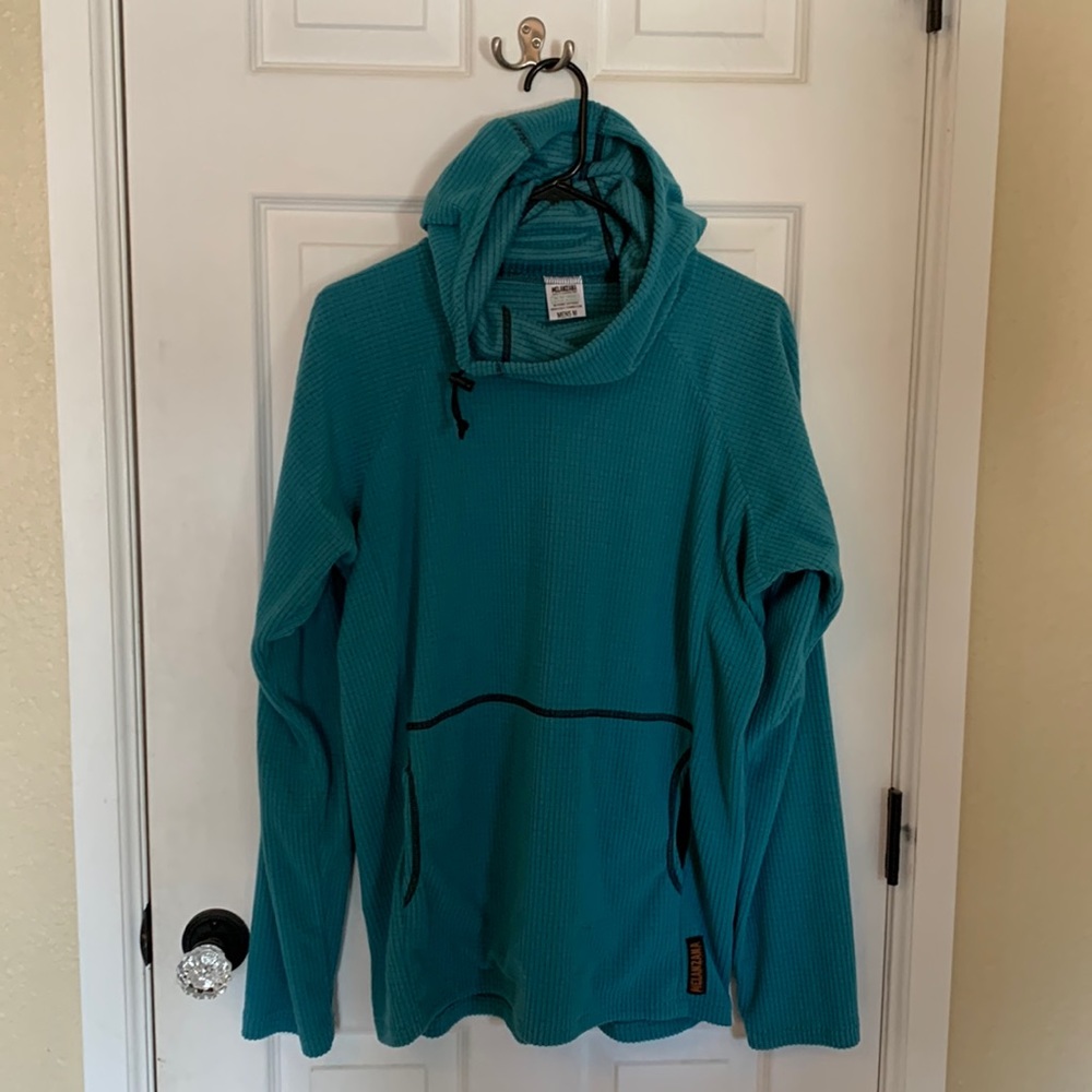 Authentic Melanzana bought in Leadville. I would say the size is M/L. Runs big.